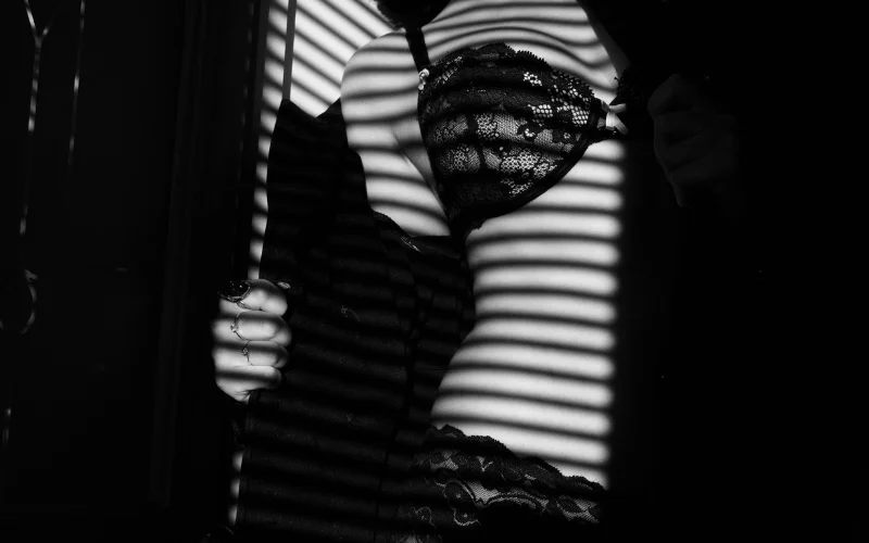 semi nude woman in black lingerie