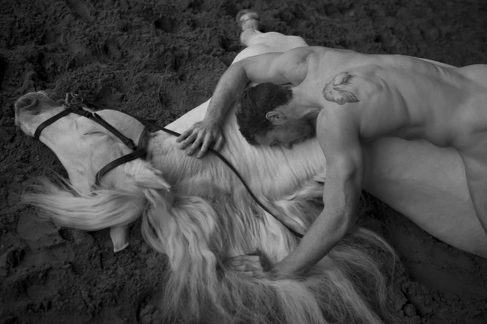 nude man with a horse black and white