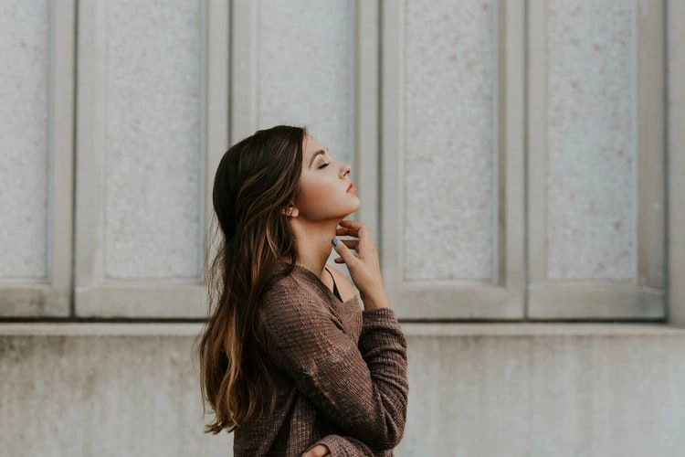 model touching chin pose