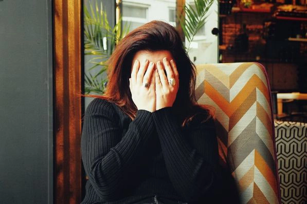 Woman Hands Covering Face