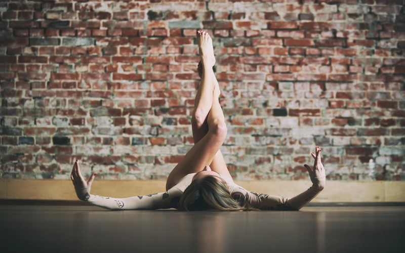 A woman practising yoga and posing for her human figure photoshoot