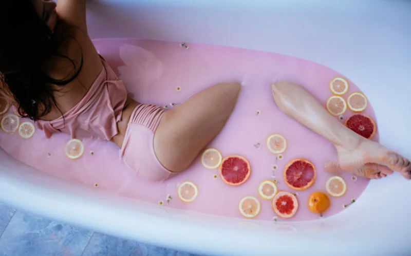 beautiful woman in a bathtub, peaceful milk bath photography, classic milk bath boudoir, dreamy nude bath portraits, minimalistic milk bath photography