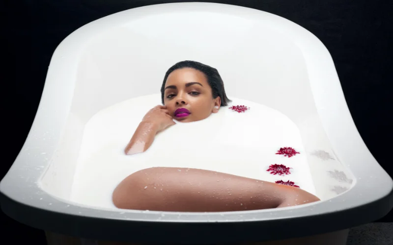 milk bath maternity shoot, goddess-style milk bath, cinematic milk bath portraits, nude self-love photography