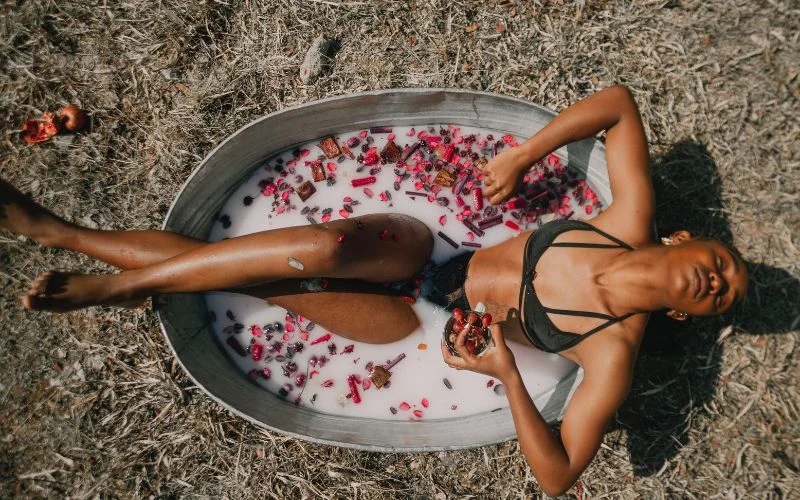 woman in a milk bath, bathtub photography nude, water boudoir photography, delicate milk bath photography, high-end milk bath photography, body positivity milk bath