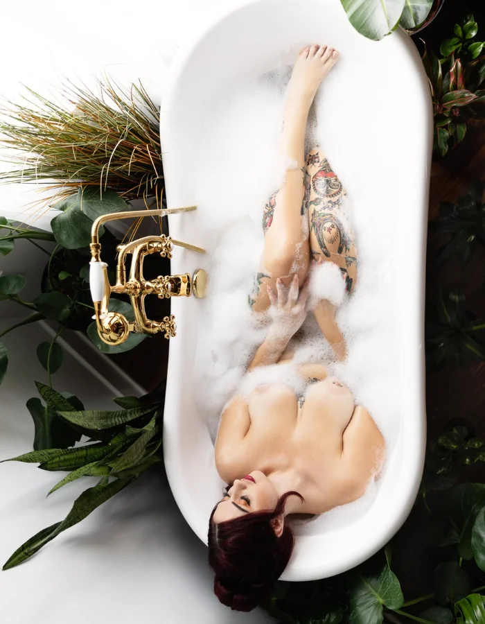 women bathing in vintage tub