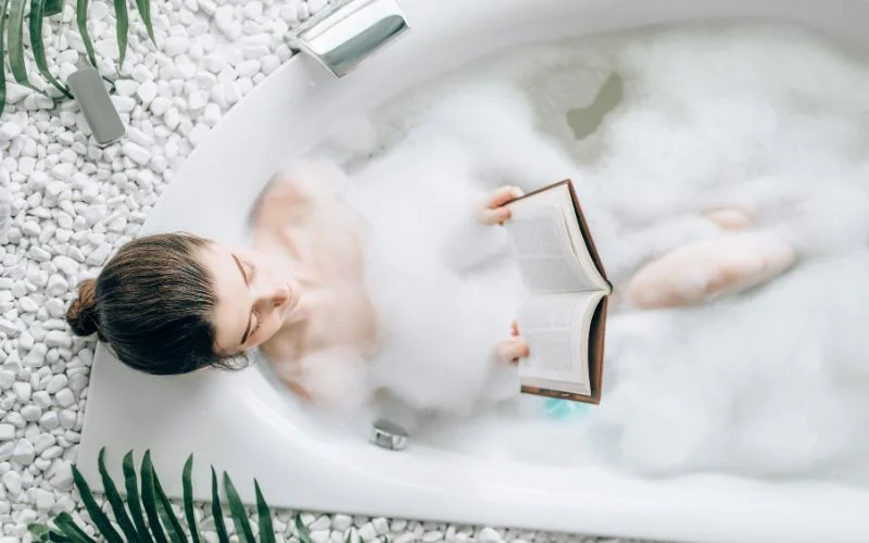 bathtub nude while reading a book
