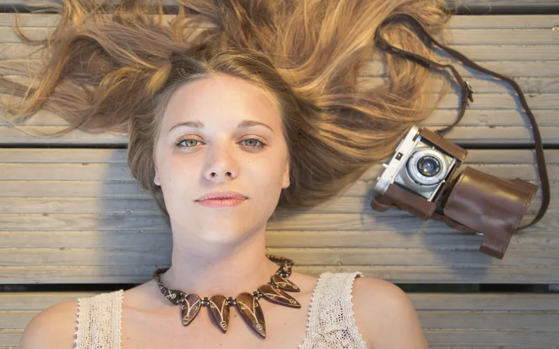 Model posed at a dramatic angle, showing how implied photoshoot photographers use perspective to create tasteful shadow effects