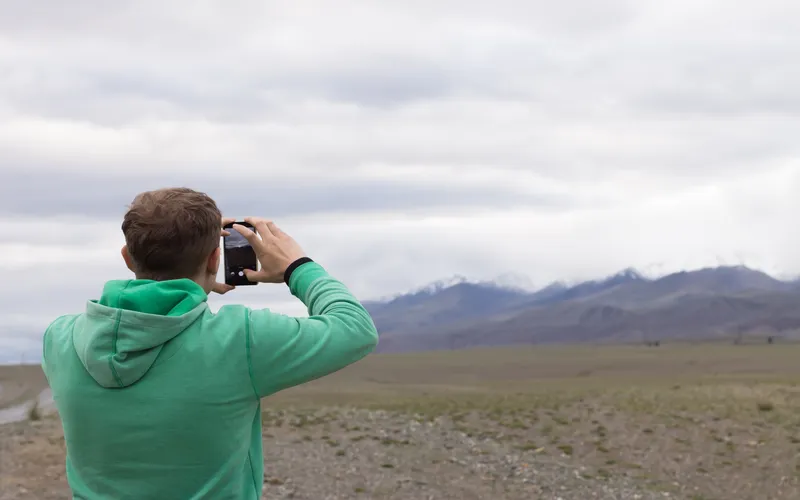 man clicking photos of nature