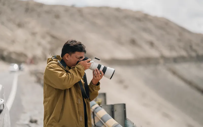 man clicking photos with camera