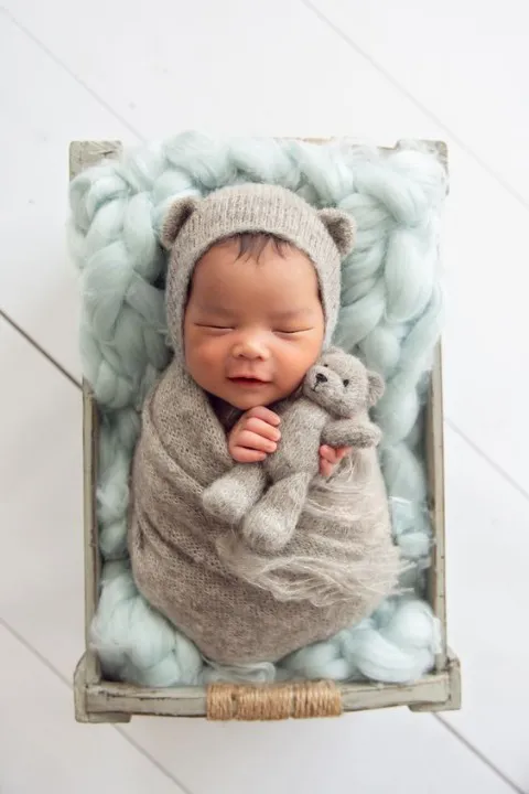 Baby with his soft toy
