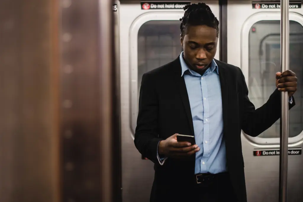 Man using phone in train
