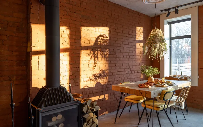 dining place by the window with natural light and brick loft