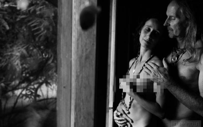 black and white image of a nude couple