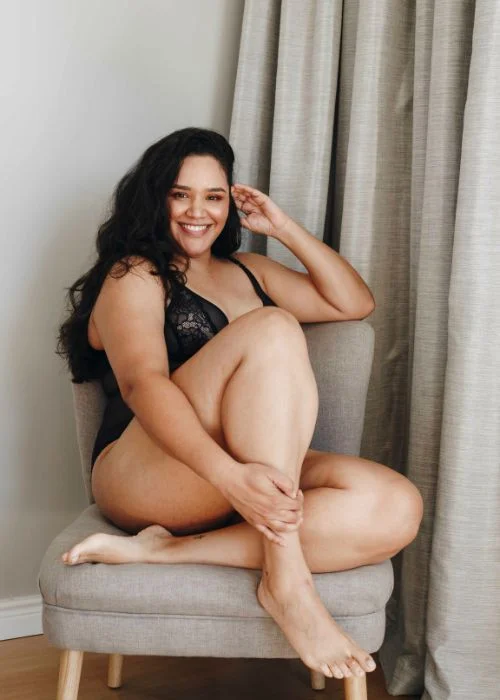 Intimate boudoir photoshoot featuring romantic styling and expressive posing