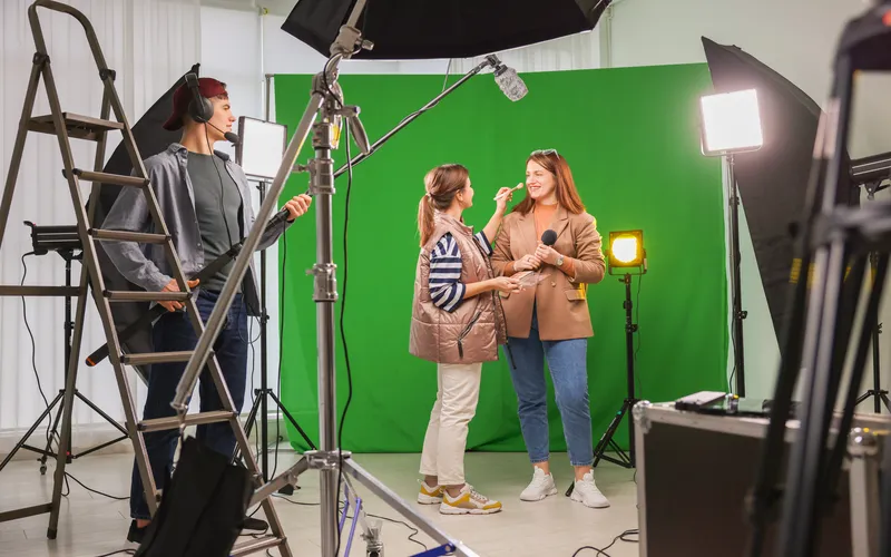 women getting ready to shoot content against a green screen