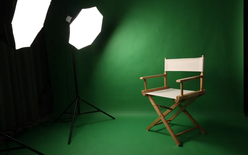 green backdrop with chair for photography