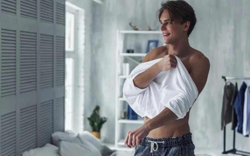 male boudoir poses while undressing