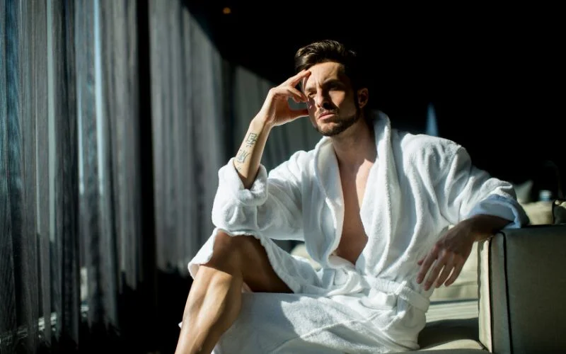 male boudoir poses with props