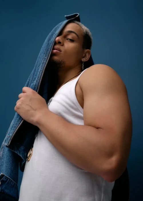Curvy male model posing for a boudoir photography session