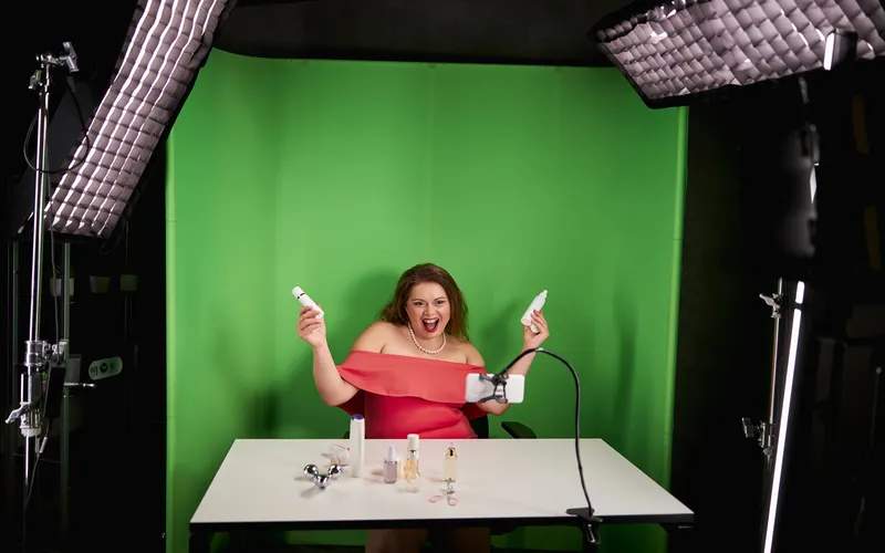 content creator shooting content against a green screen