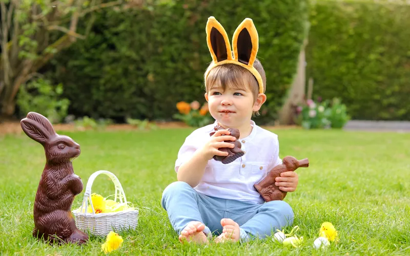 kid eating chocolate bunny photo