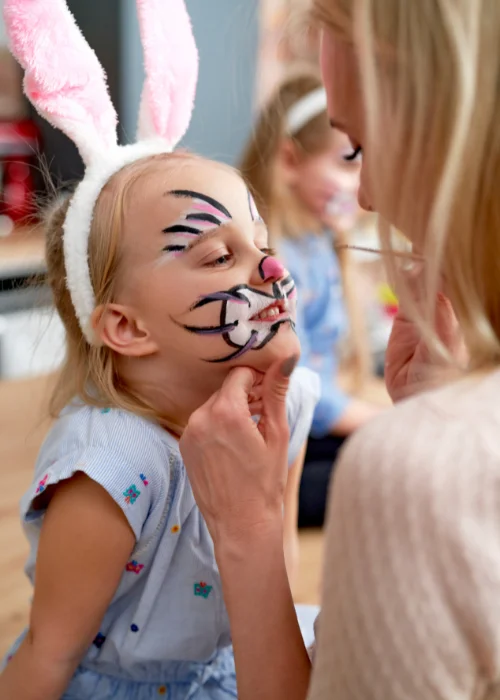 siblings wearing bunny tails and ears, creative Easter indoor photos wearing matching outfits