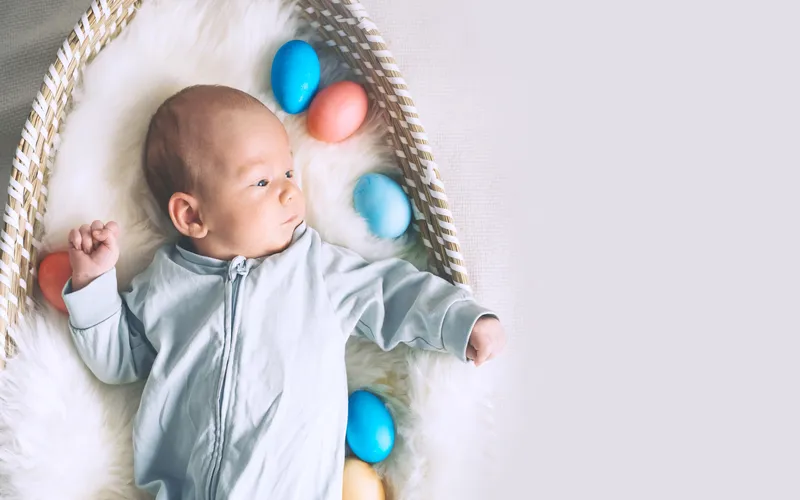 newborn easter photography- baby and easter eggs in a basket
