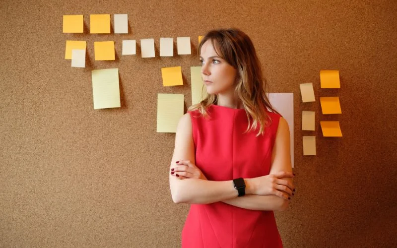 Colorful sticky notes covering a wall in a grid pattern, a quirky DIY backdrop idea