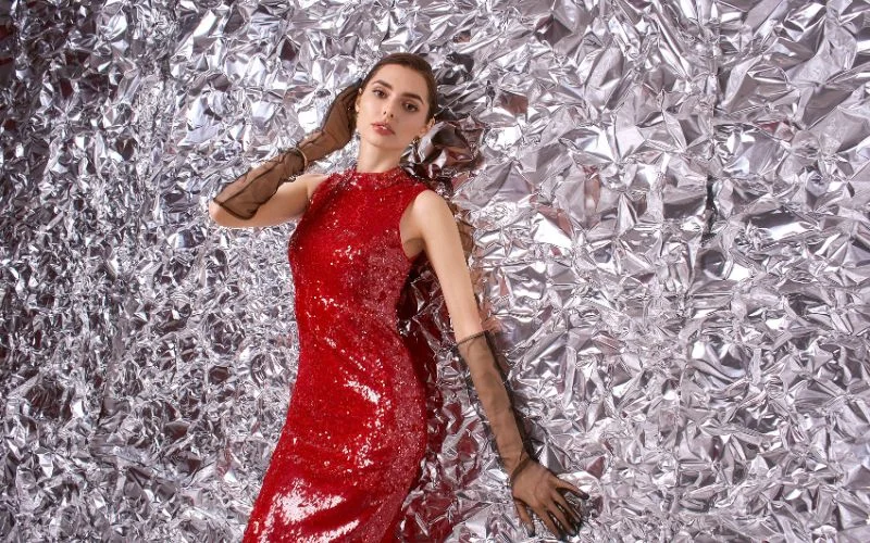 Crinkled tin foil backdrop reflecting light for a textured, metallic photo background