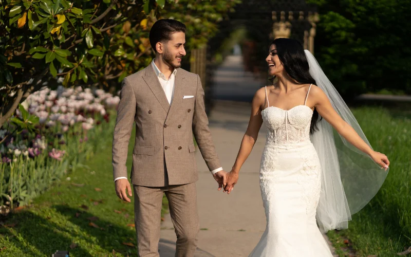 bride and groom hand in hand