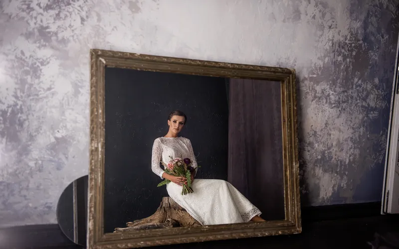 fine art photography of woman posing in white gown