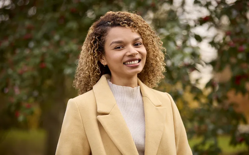 portrait of a smiling woman outdoors