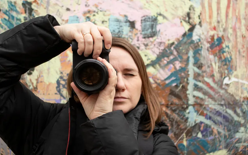 woman holding a camera