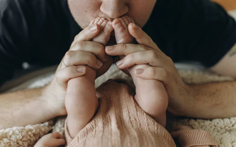 father kissing baby's feet - detailed images for Father's Day photoshoot