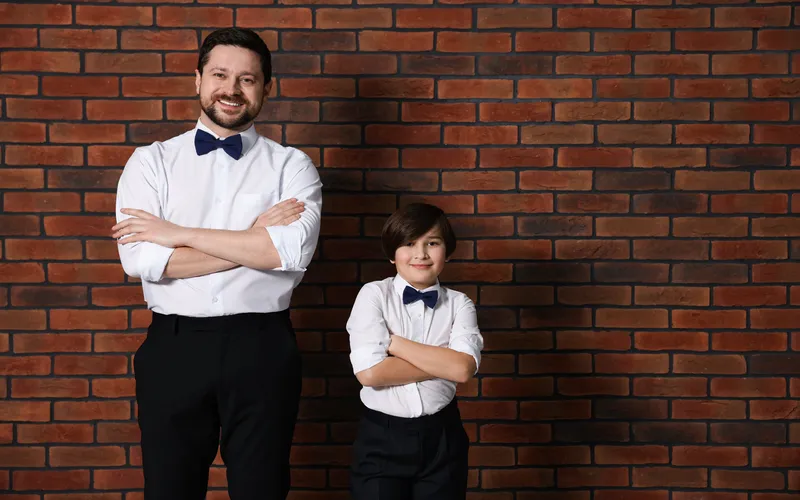 photoshoot of father and son while wearing matching outfits