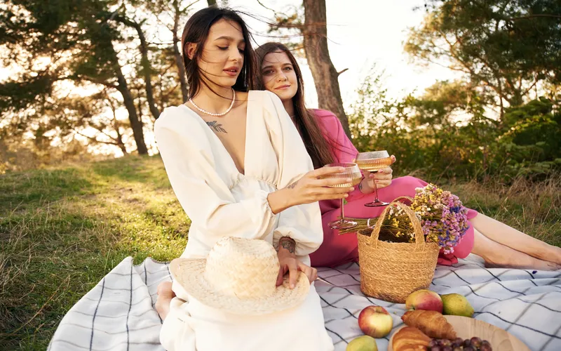 two women on a boho themed picnic