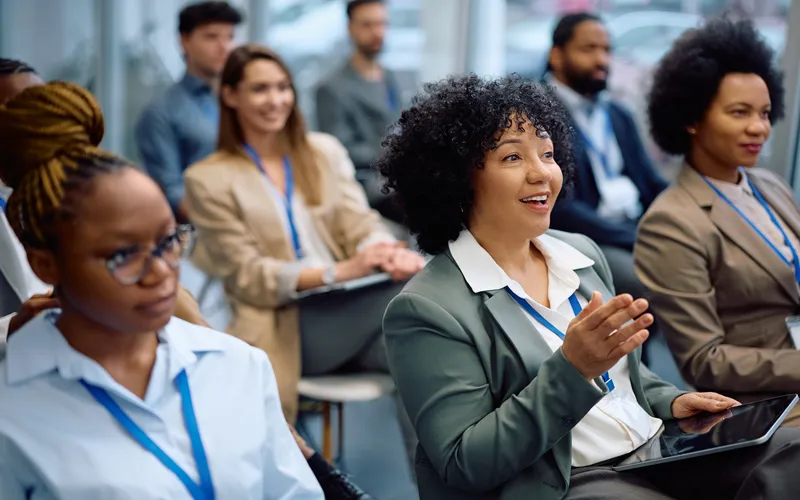 attentive crowd engaging with speaker at a business seminar