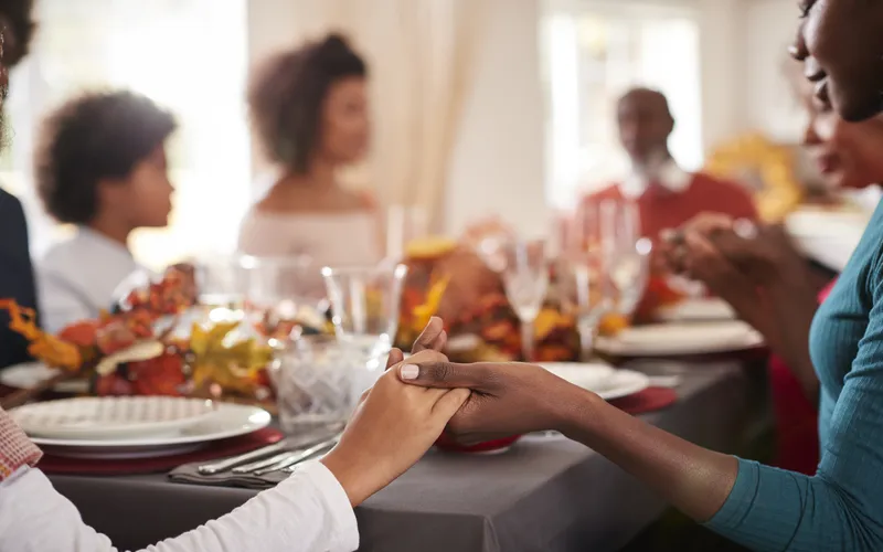Thanksgiving dinner photo while family is praying
