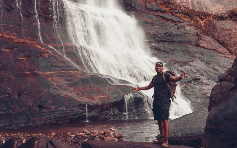 hiking portraits in front of waterfall