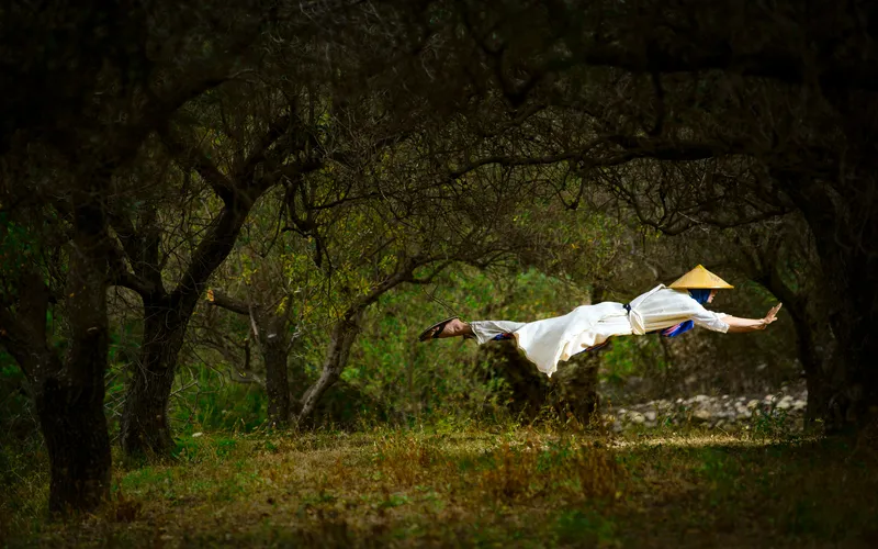 levitating man in forest