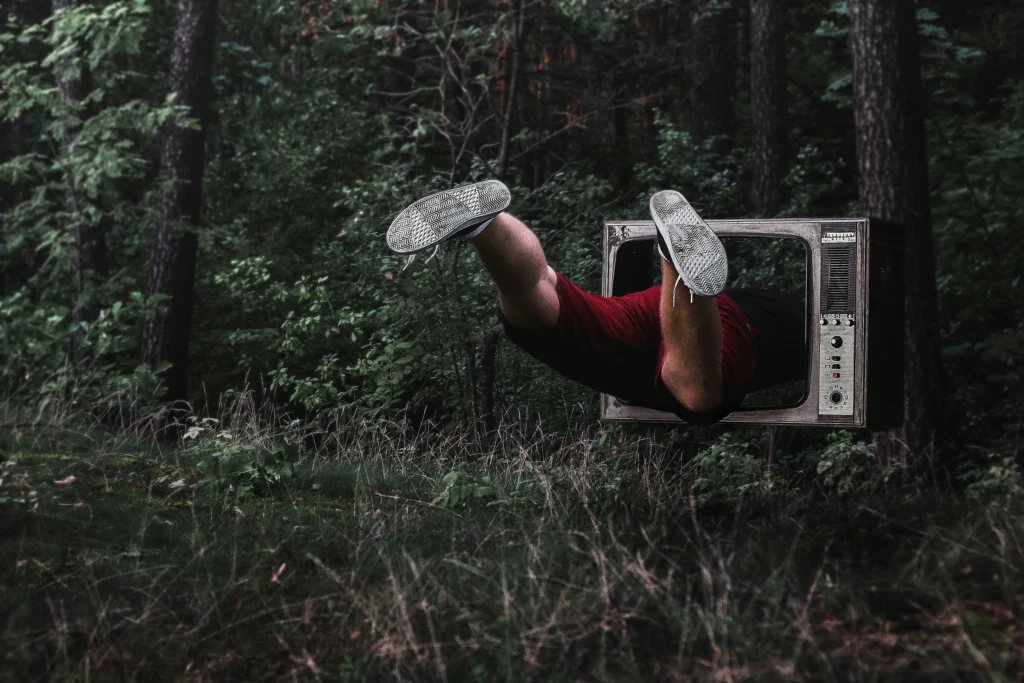 a man entering a TV