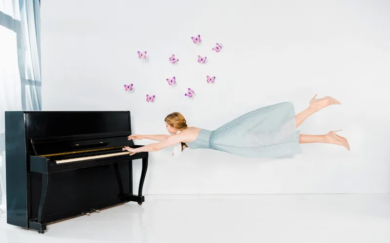 levitating woman playing piano