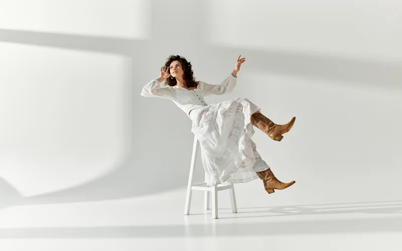 surreal levitation photography of model on a chair