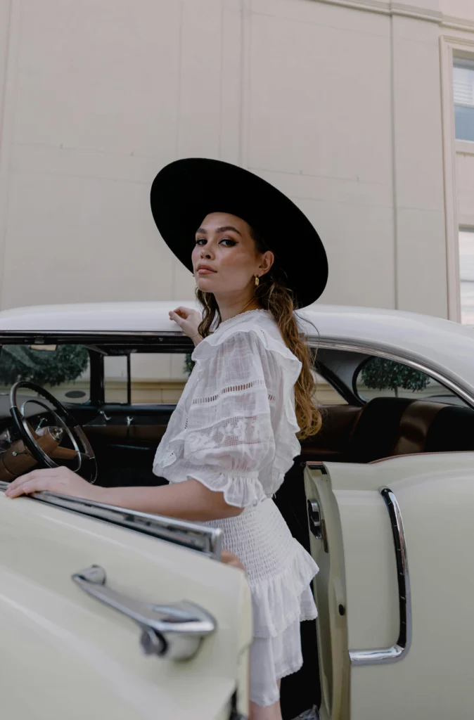 a model posing with the door - car photography poses