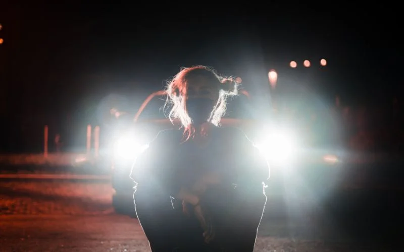 photoshoot with car ideas - a model posing in front of the car