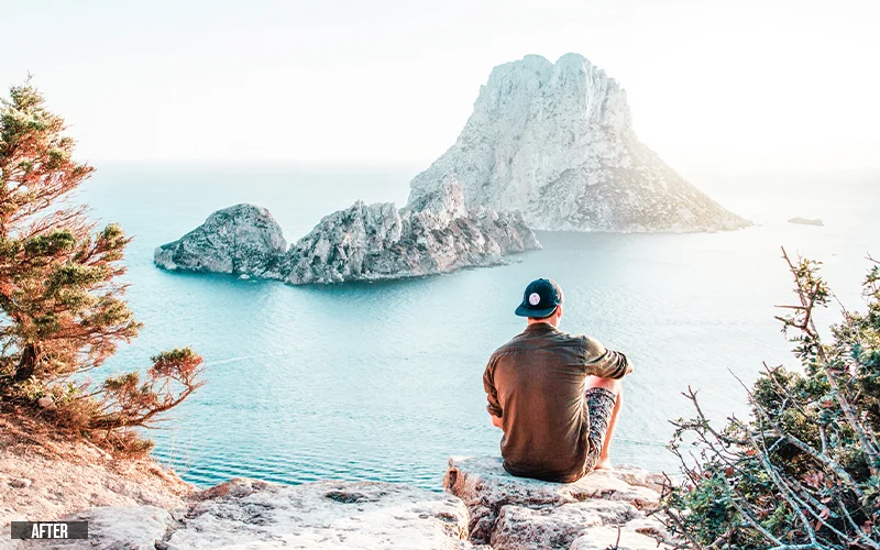 a view of an island with a man sitting