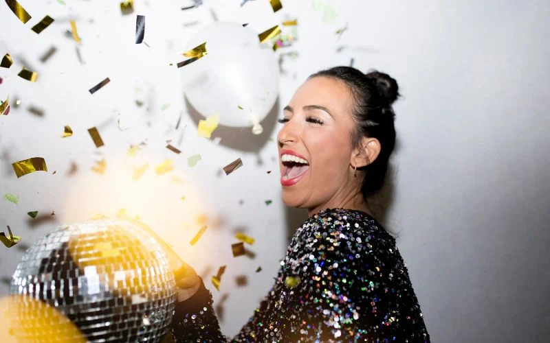pose with disco balls