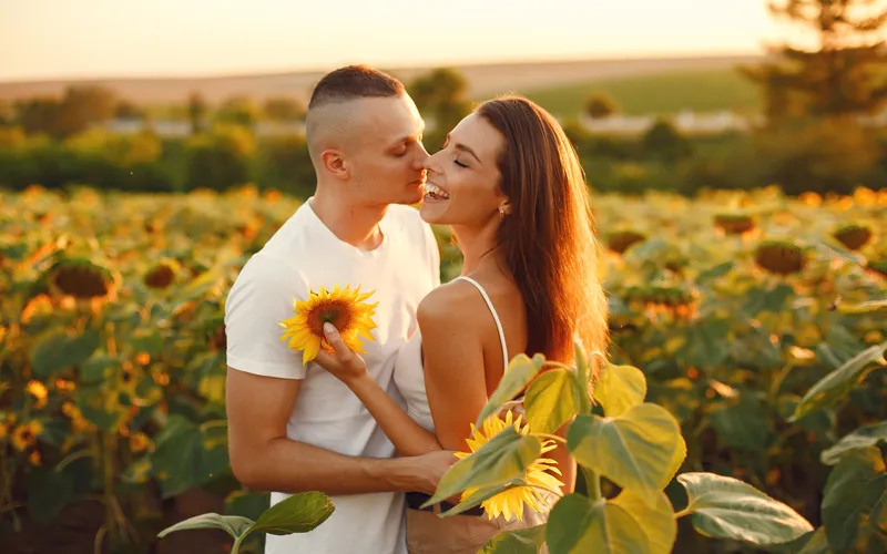 sunkissed couple posing for their photoshoot i