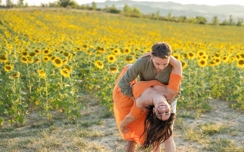 romantic couples photoshoot in the middle of sunflower field