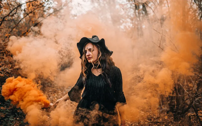 Halloween photoshoot using smoke bomb for dramatic effect